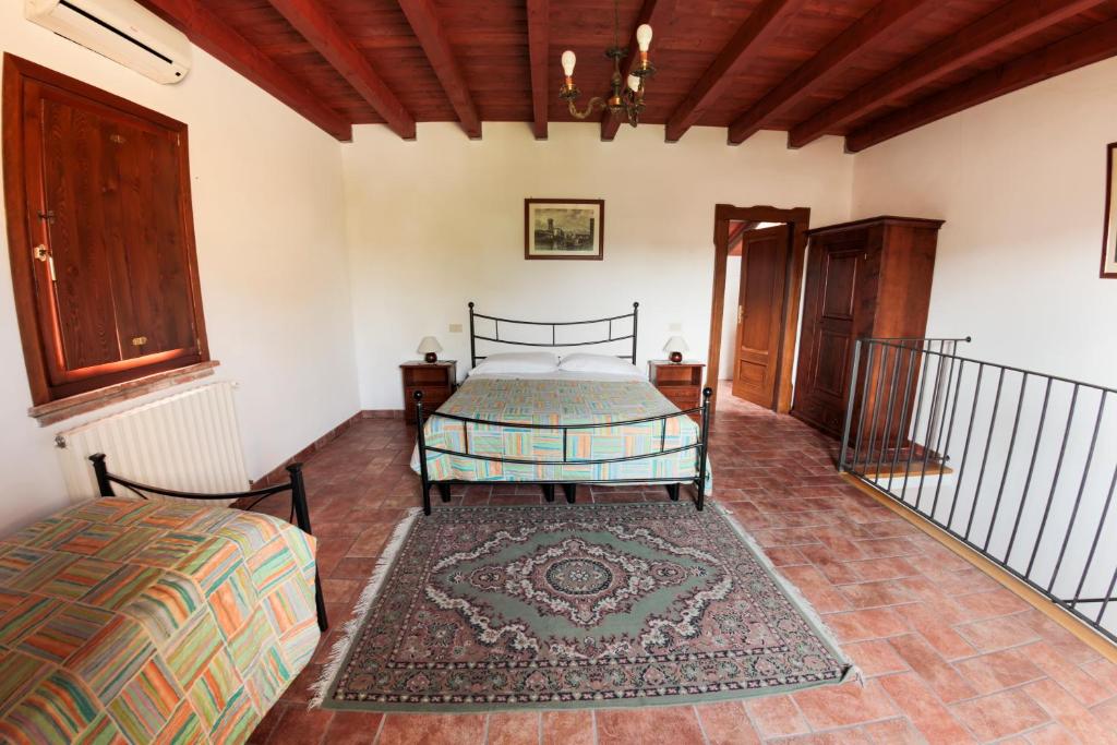 Postel nebo postele na pokoji v ubytování Agriturismo Gardenali