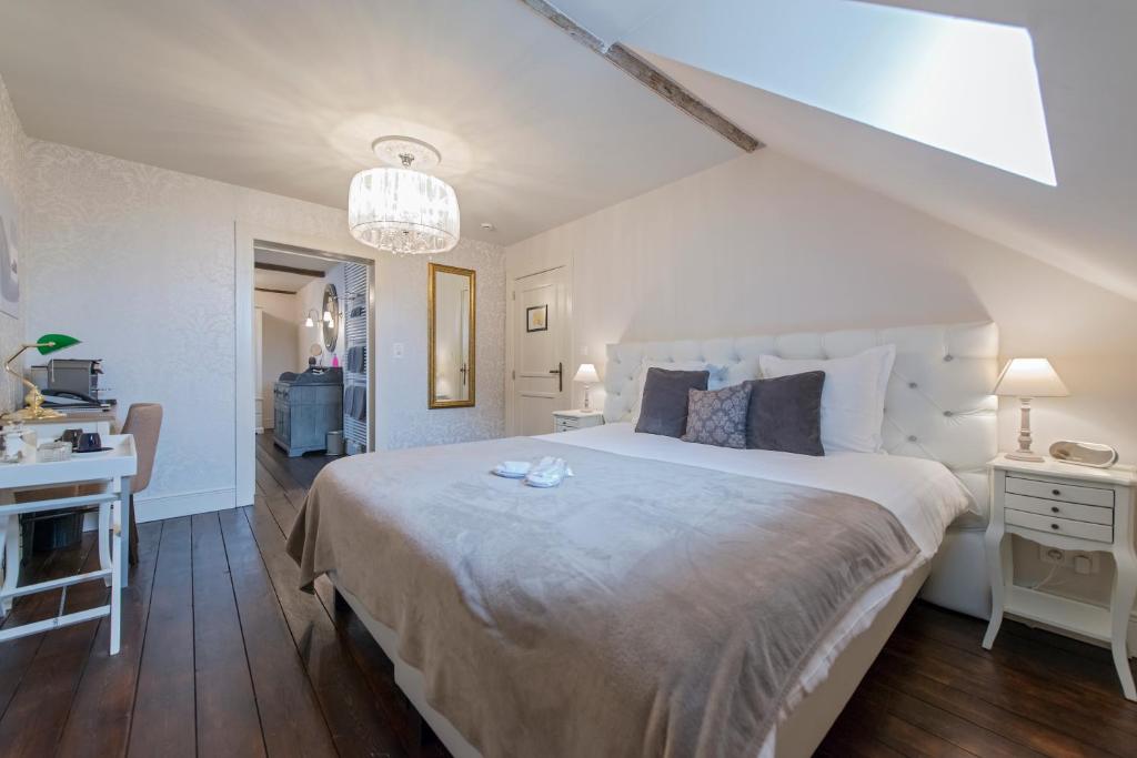 Postel nebo postele na pokoji v ubytování Boutique Hotel Huys van Steyns