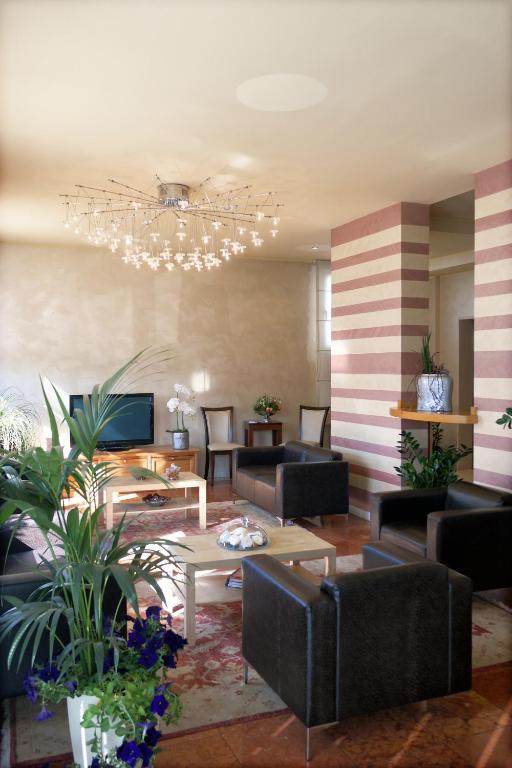 TV a/nebo společenská místnost v ubytování Hotel Vittoria
