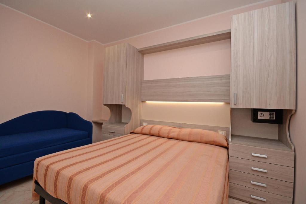 Postel nebo postele na pokoji v ubytování Hotel Concorde