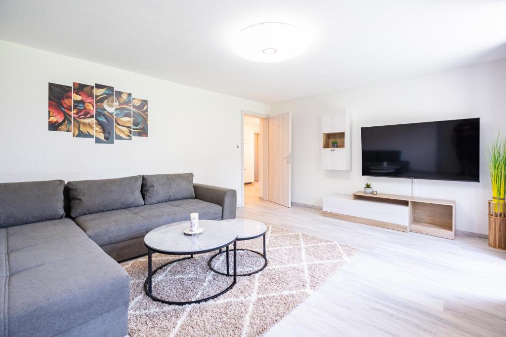 a living room with a couch and a table at Apartments Lian in Bled