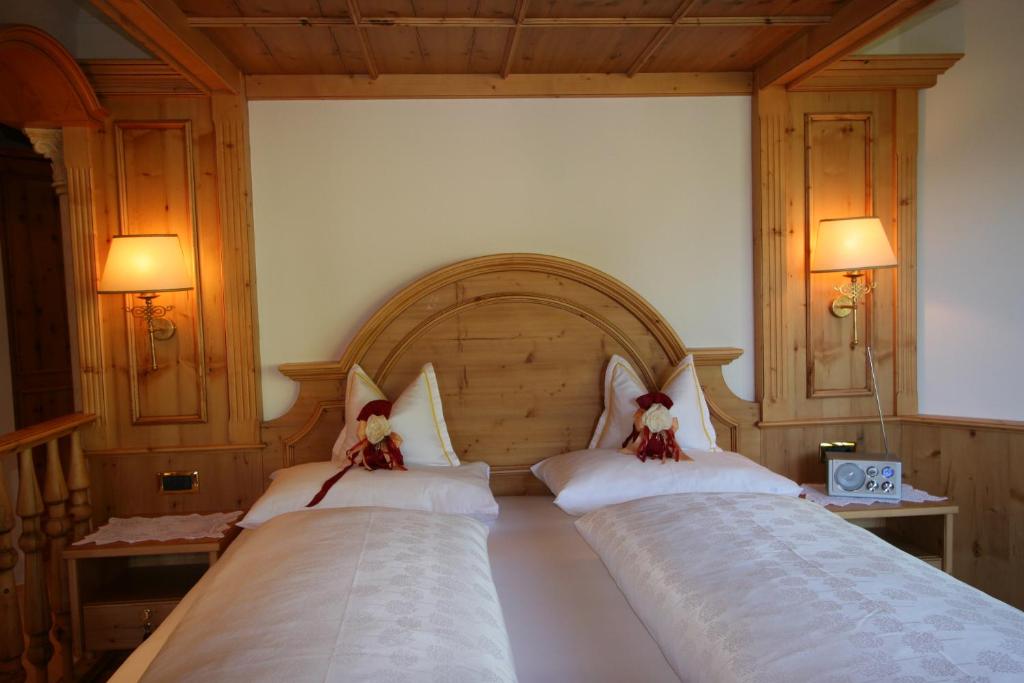 Postel nebo postele na pokoji v ubytování Hotel Al Sonnenhof