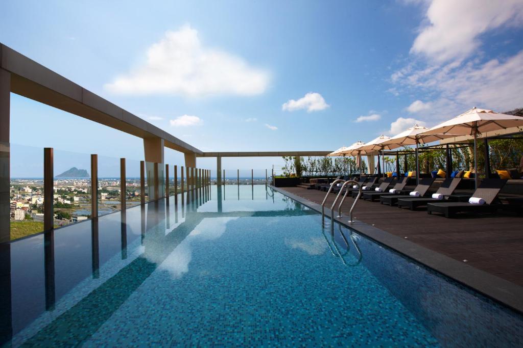 a swimming pool on the roof of a building at Wellspring by Silks in Jiaoxi