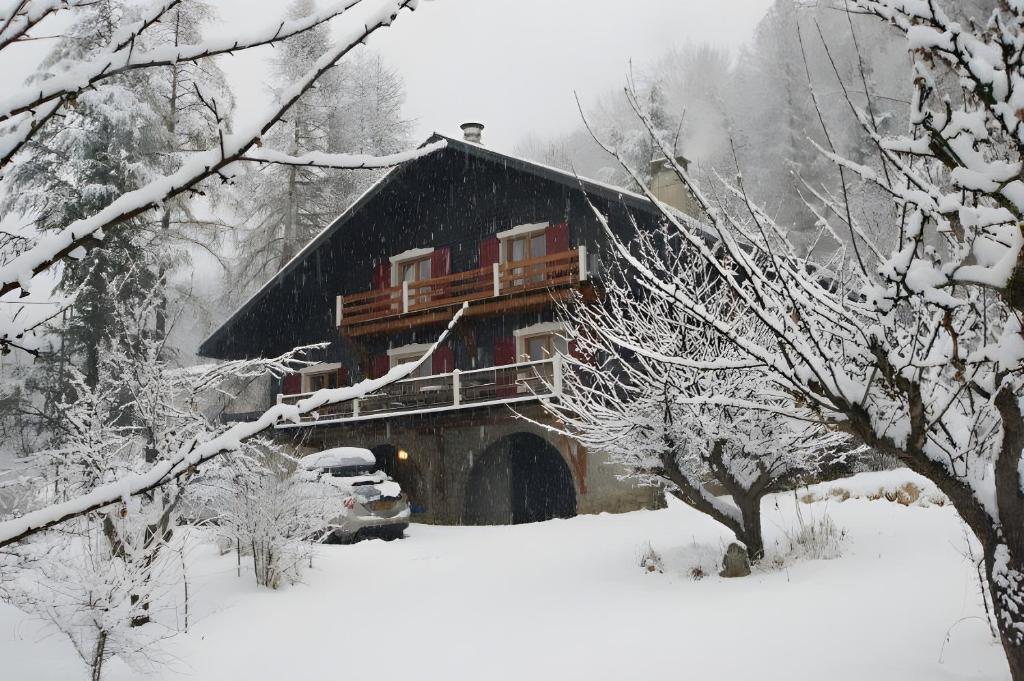 a building with a balcony on top in the snow at Chalet de luxe - Alpes française in Colmars