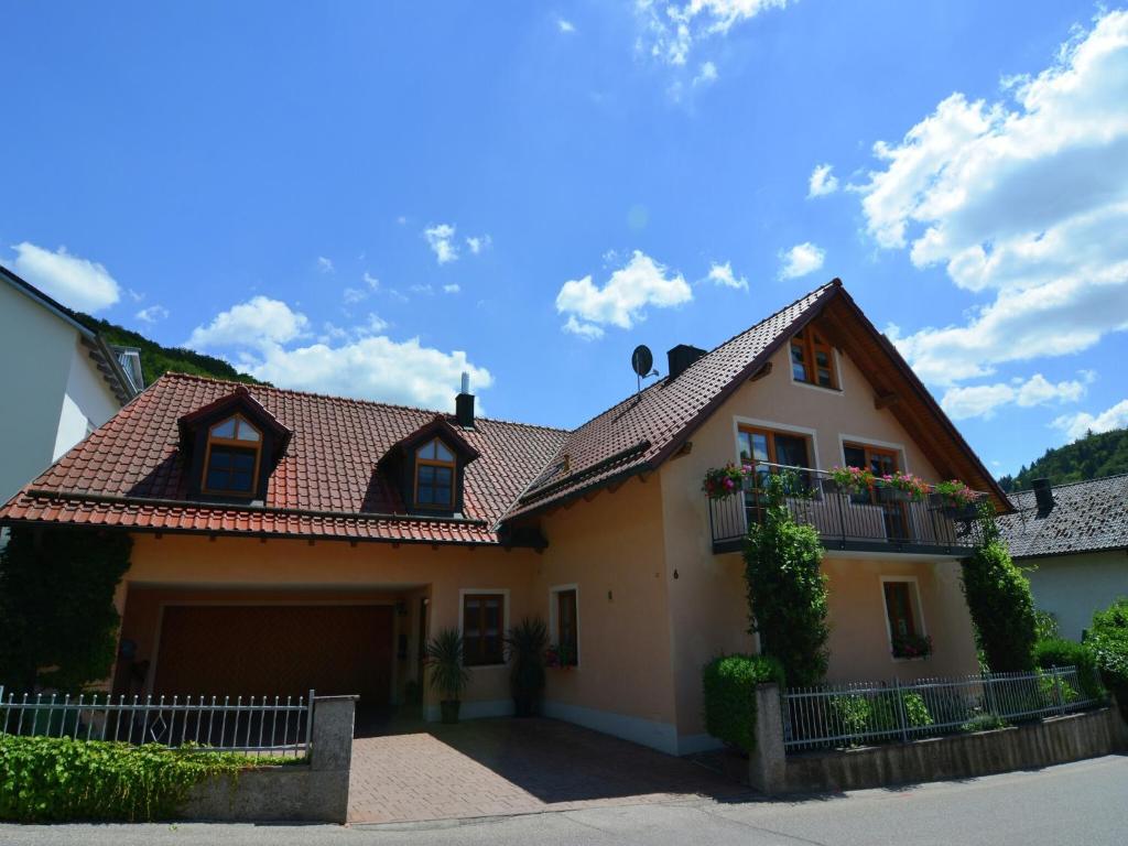 a house with a tiled roof at Homely Apartment in Riedenburg Prunn near Forest with BBQ in Riedenburg