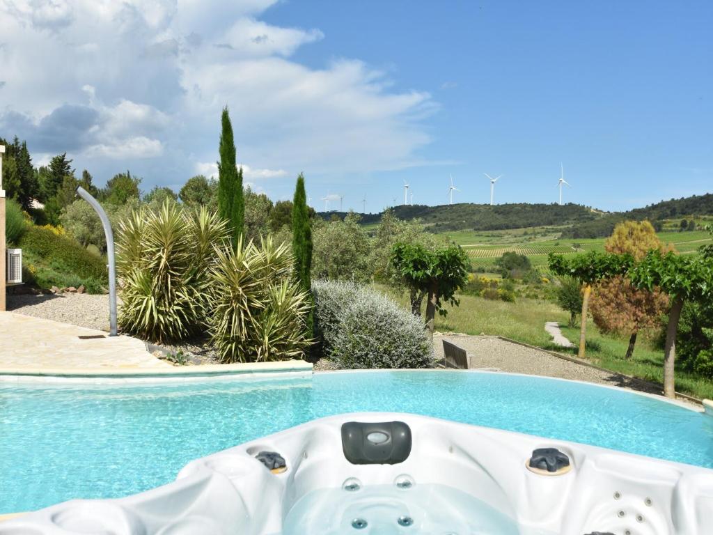 a swimming pool in a villa with a view at Villa with heated pool, jacuzzi, sports field and stunning views in Montbrun-des-Corbières