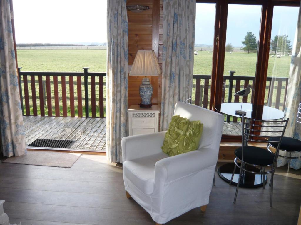 Posezení v ubytování Spacious cottage with sauna looking out on astonishing grasslands