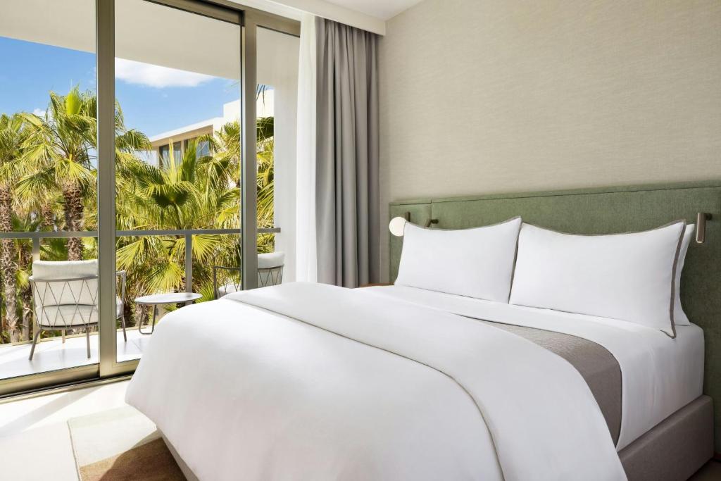 
Three-Bedroom Suite with Balcony and Pool View
