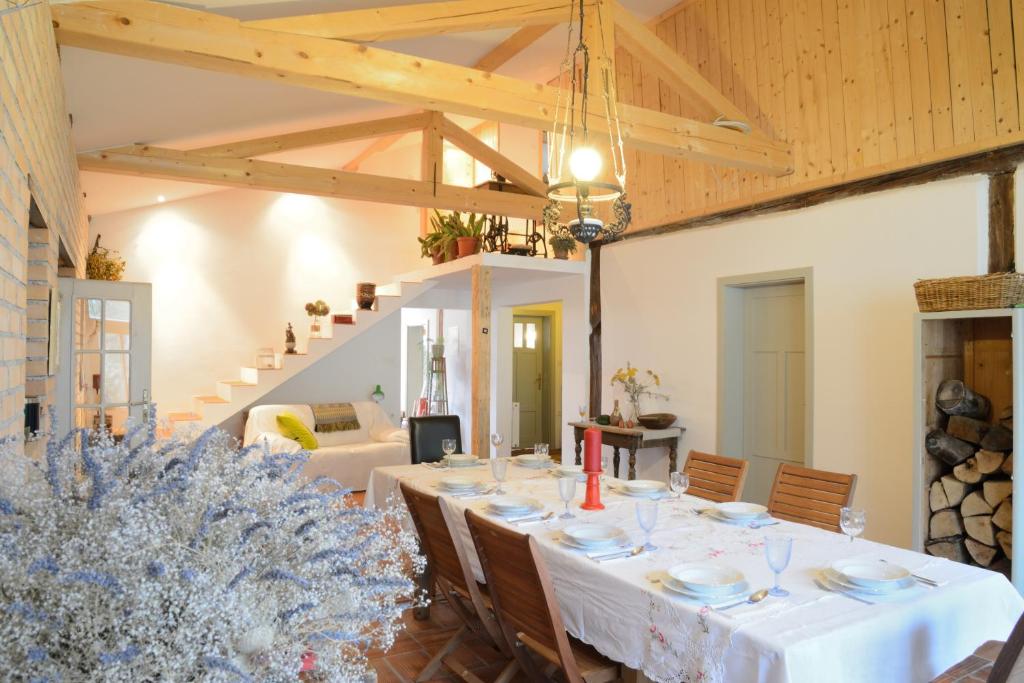 a dining room with a table in a room at Mala Kmetija in Slovenske Konjice