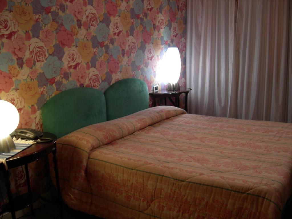 Postel nebo postele na pokoji v ubytování Hotel Il Falchetto