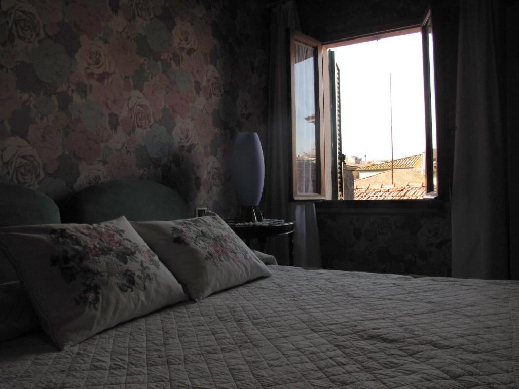 Postel nebo postele na pokoji v ubytování Hotel Il Falchetto