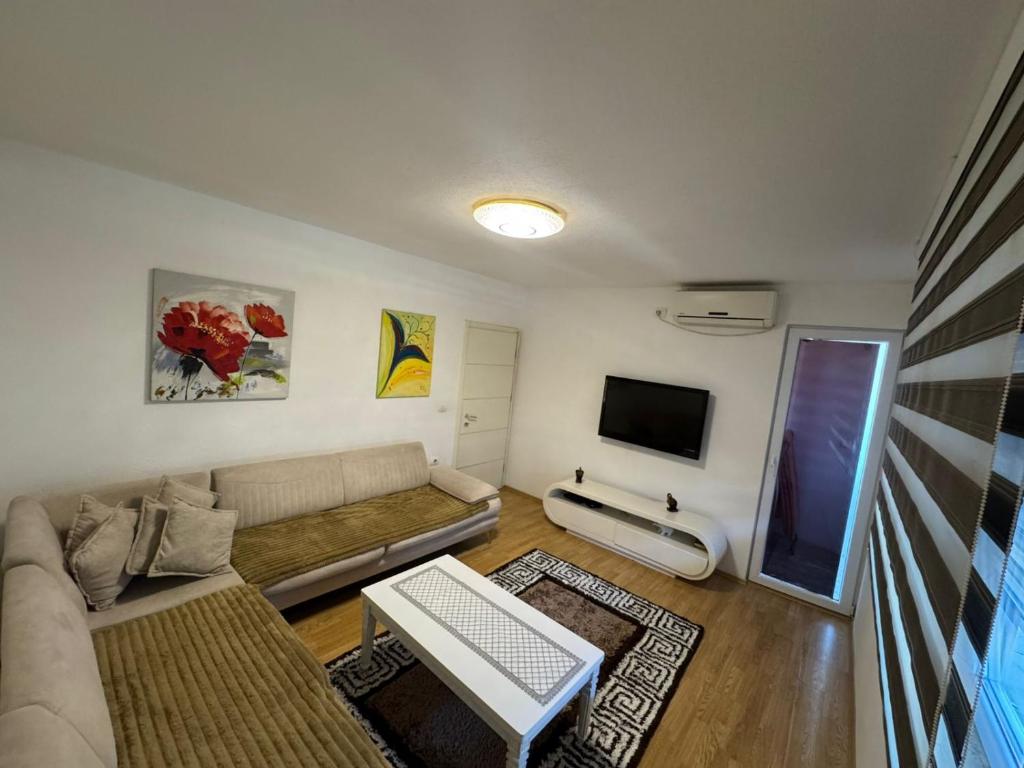 TV a/nebo společenská místnost v ubytování City Center Apartments