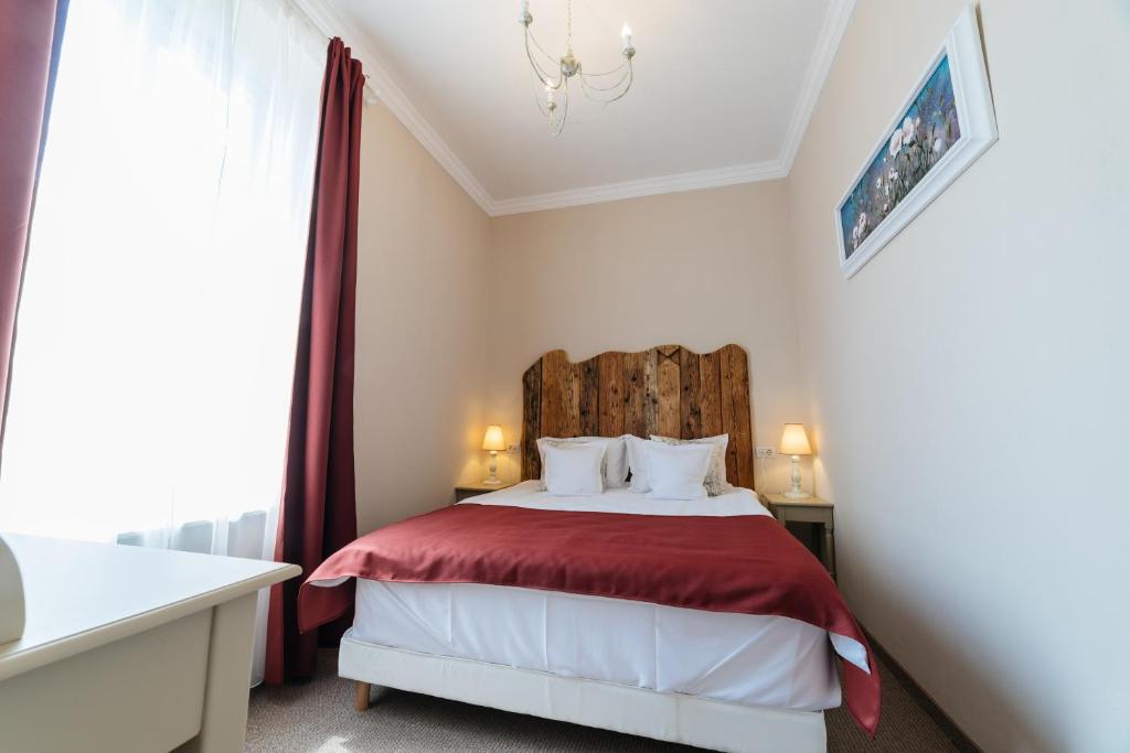 Postel nebo postele na pokoji v ubytování Vila Boem