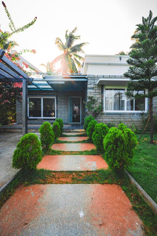 a house with a pathway in front of it at SSS Farm House in Cheyūr
