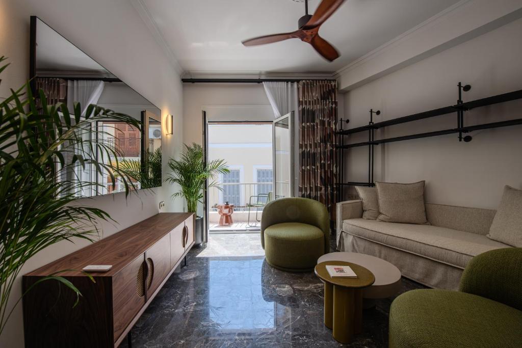 a living room with a couch and a table at Porto Searene in Nafplio