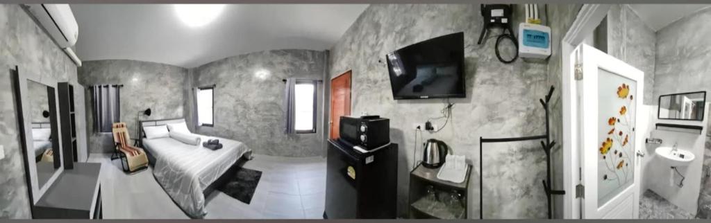 TV a/nebo společenská místnost v ubytování Baan Raweewan Resort