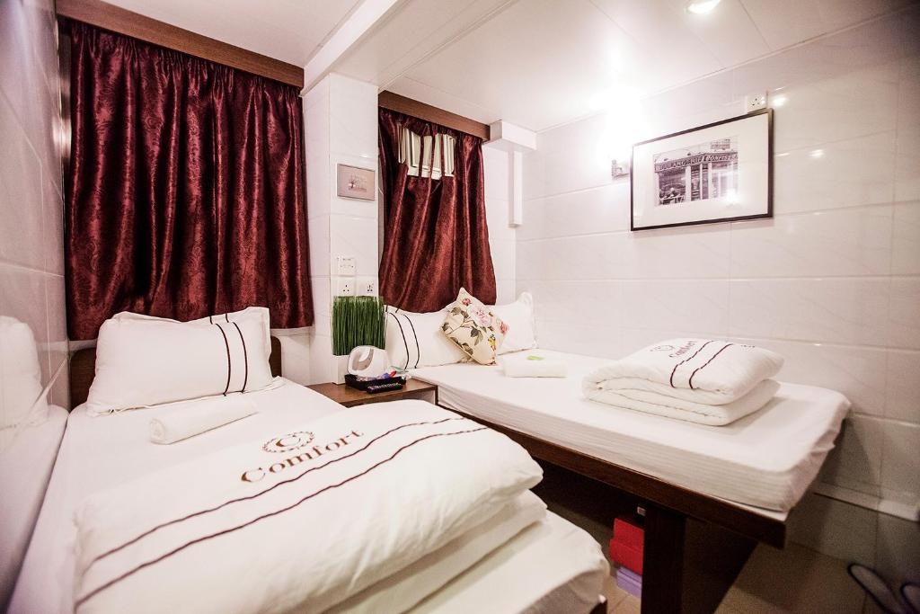 Voodi või voodid majutusasutuse Sun Guest House toas