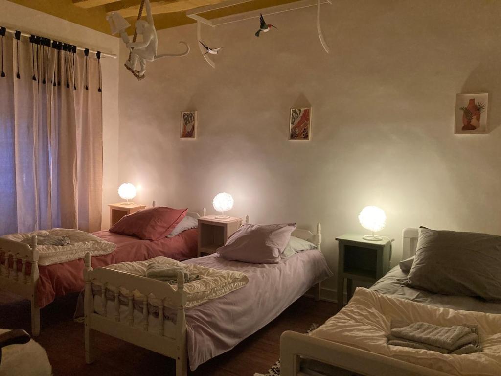 Ένα ή περισσότερα κρεβάτια σε δωμάτιο στο Villa Krystina Gîte de Charme