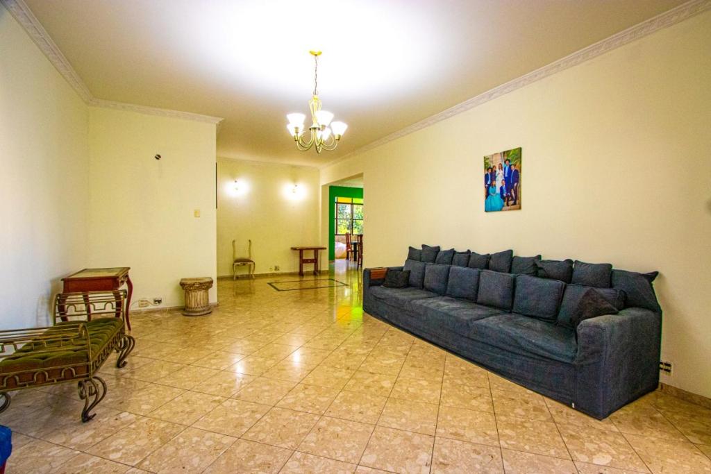 a living room with a couch and a table at APT Perto da praia de Copacabana in Rio de Janeiro