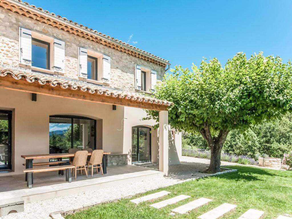 a villa with a view of the garden at Holiday Home in Vaison la Romaine with Pool in Vaison-la-Romaine
