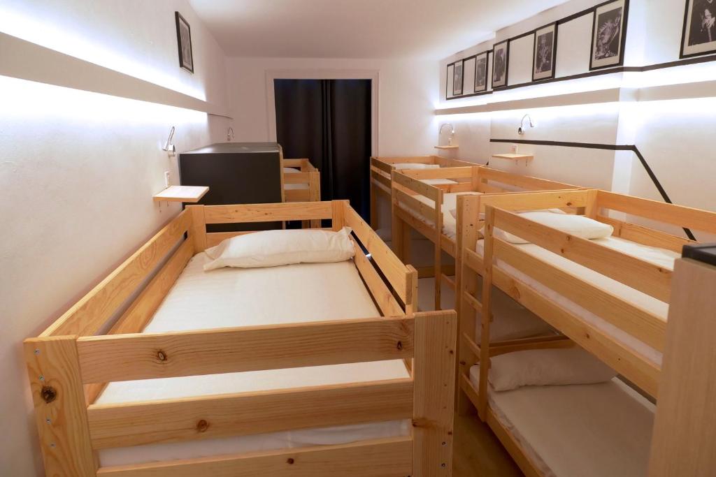 a room with two bunk beds and a desk at bcool in Bilbao