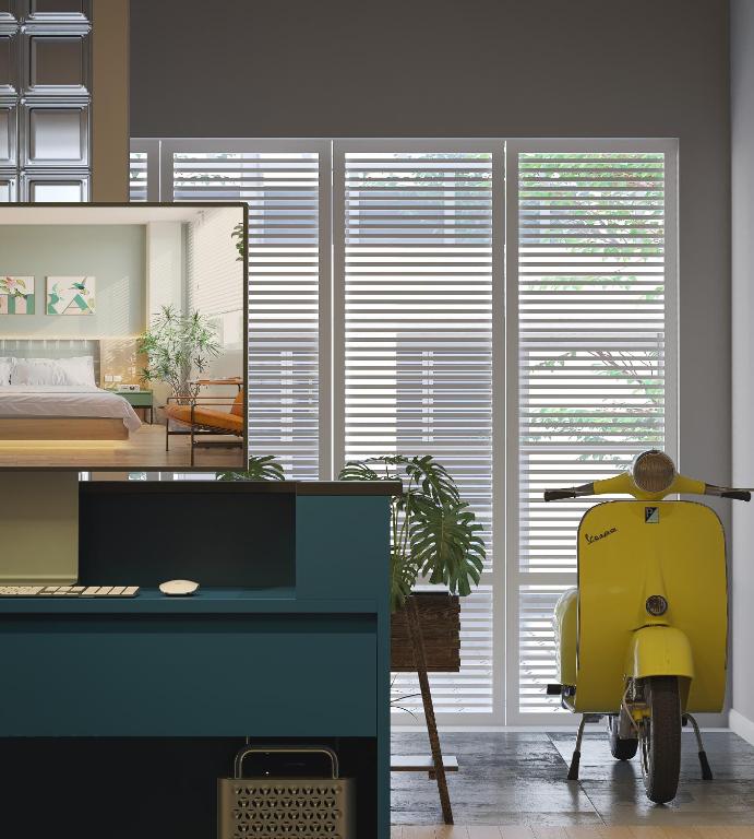 a room with a yellow scooter in front of a mirror at Mik Stay in Danang