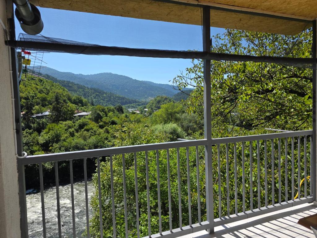 a view from the balcony of a house at Cottage Mtkvari in Borjomi