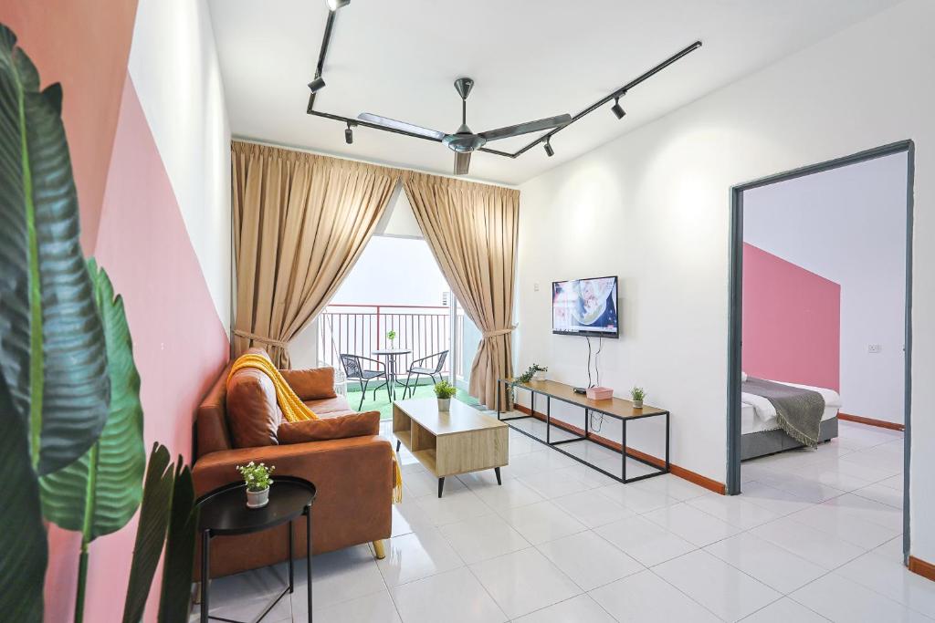 a living room with a couch and a bed and a mirror at Cloverhill Emerald Avenue Apartment Highland Elegance Stay Clover Home 5-03 in Brinchang