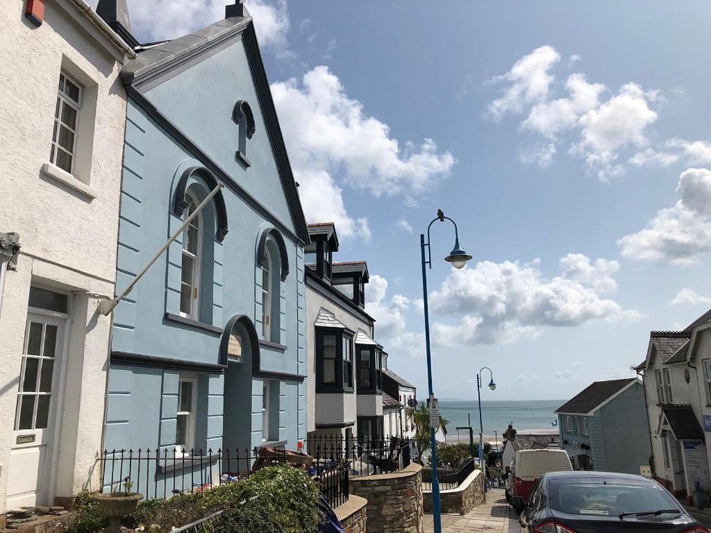 a blue and white building on the side of a street at The Old Chapel in Saundersfoot