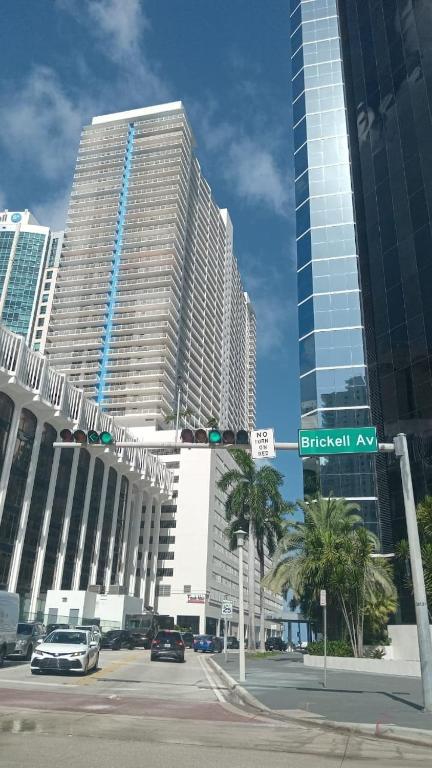 a traffic light on a street with tall buildings at Stunning view from 42nd floor, Brickell-Miami financial district free self-parking spot, sleeps 4 in Miami