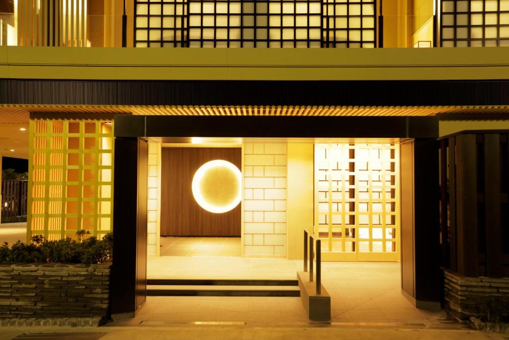 a building with a door with a moon on it at Tsukino Yado Sara in Hakone