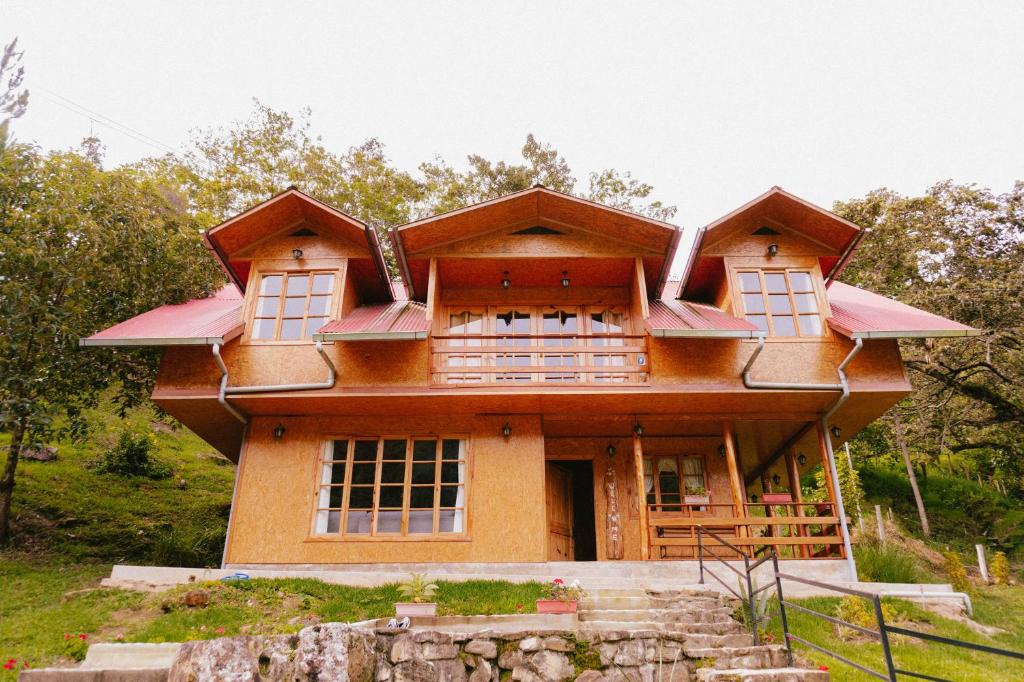 a house on the side of a hill at La Arboleda Oxapampa in Oxapampa