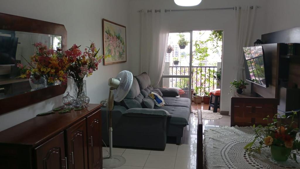 a living room with a couch and a table at Apartamento Inteiro dois dormitórios e um banheiro social - Próximo ao Parque da Cidade e Hangar - COP30 in Belém
