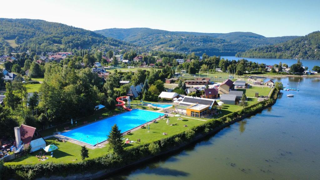 an aerial view of a resort next to a river at Relaks domki i pokoje nad jeziorem in Międzybrodzie Bialskie