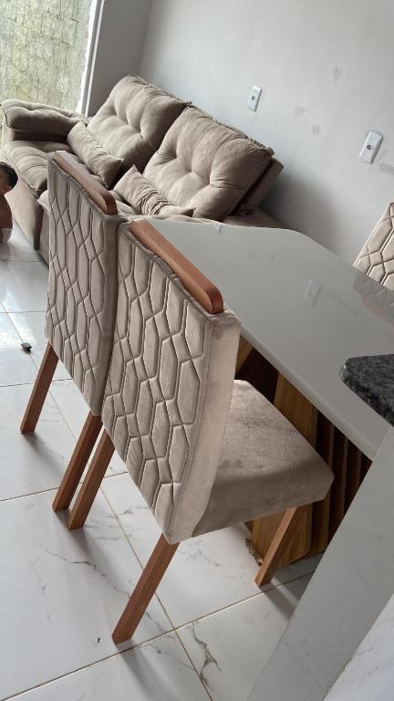 a dining table and a couch in a room at Rent for COP 30 in Belém! in Castanhal