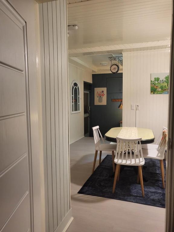 a dining room with a table and two chairs at Gwangalli Beach 3min Cozy Attic House in Busan