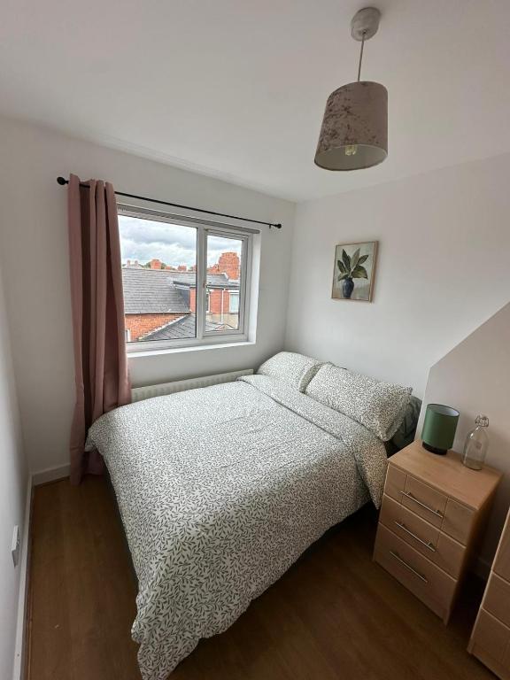 a bedroom with a bed and a window at Double bedroom on the Ormeau Road in Belfast