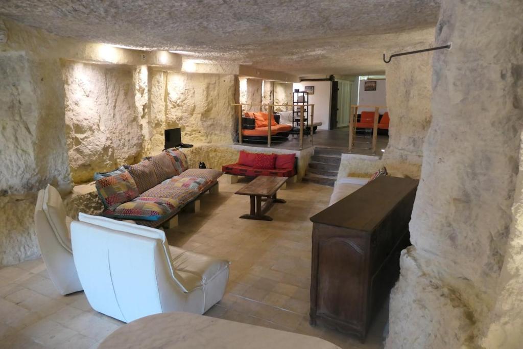 a living room with a couch and a table at la roche coeur in Vouvray
