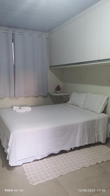Ένα ή περισσότερα κρεβάτια σε δωμάτιο στο Pousada santos 1, kitnet confortável com ar condicionado