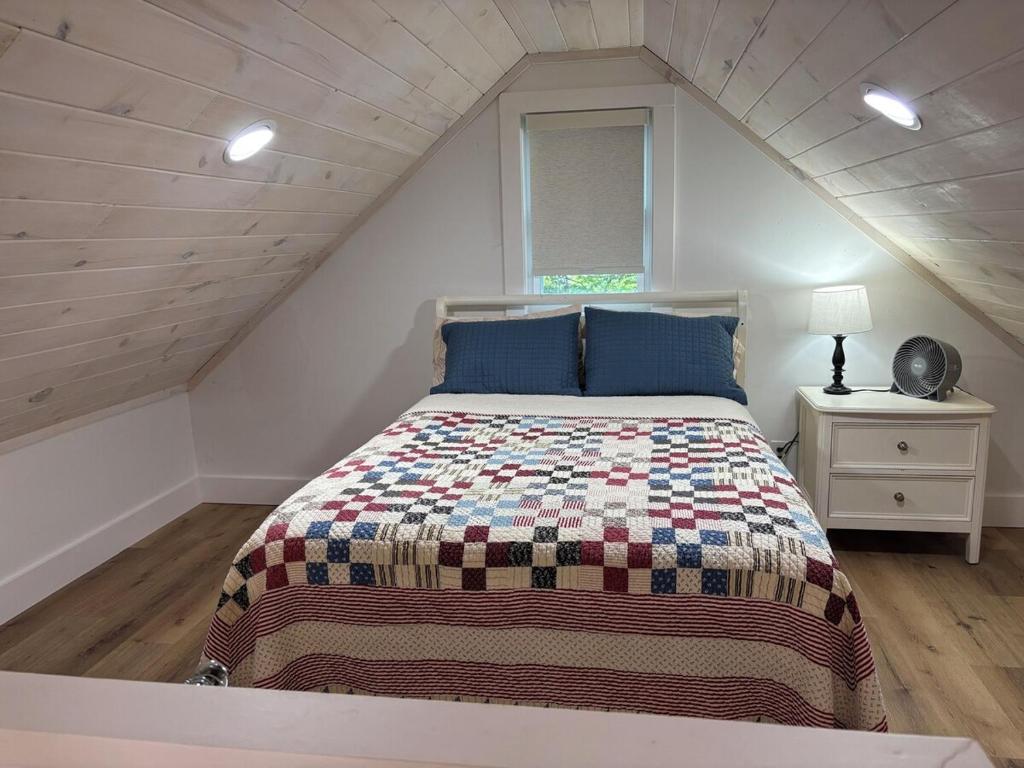 a bedroom with a large bed in a attic at Liberty Loft in Eagle Rock
