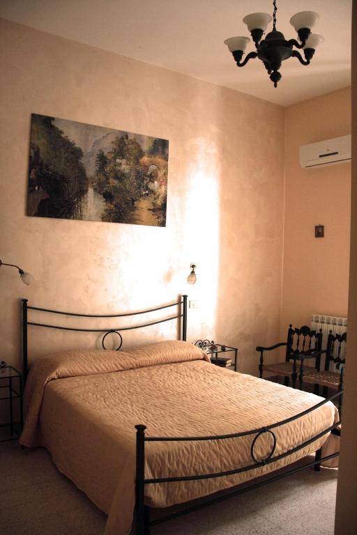 Postel nebo postele na pokoji v ubytování Domus Cicerone
