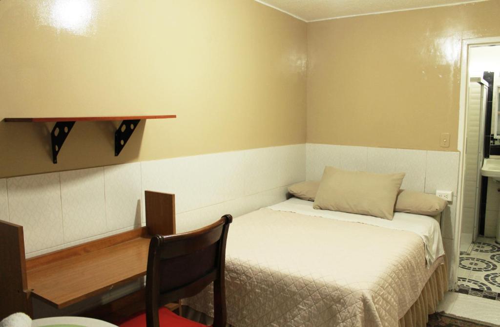 Ένα ή περισσότερα κρεβάτια σε δωμάτιο στο Casa Posada Amelia