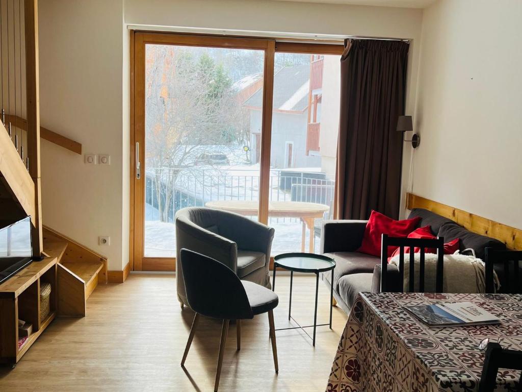 Posezení v ubytování Triplex lumineux avec parking, terrasse et casier à skis - FR-1-263-596