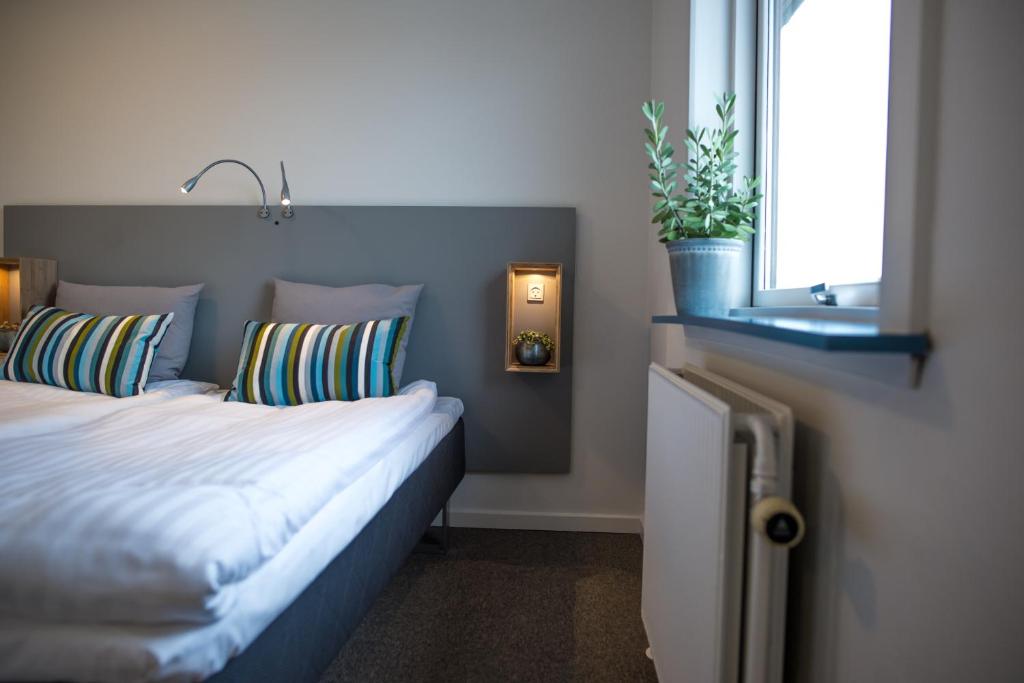 Postel nebo postele na pokoji v ubytování Refborg Hotel