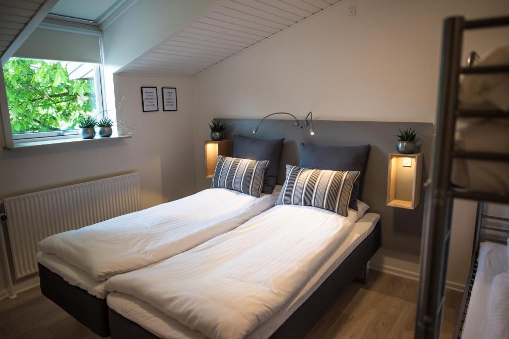 Postel nebo postele na pokoji v ubytování Refborg Hotel
