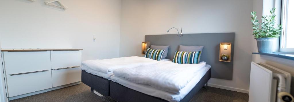 Postel nebo postele na pokoji v ubytování Refborg Hotel