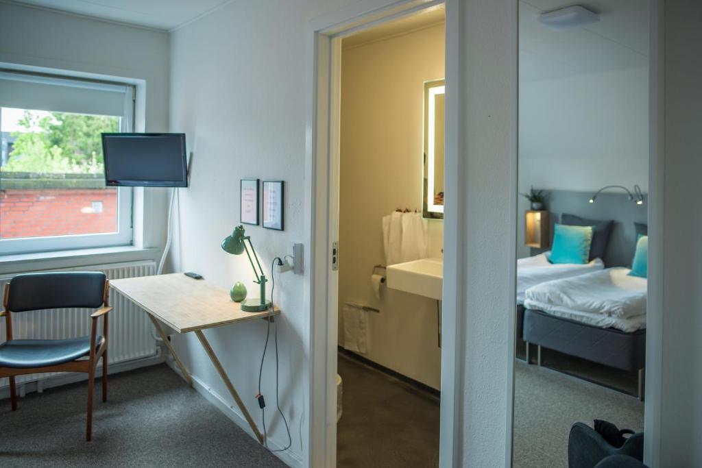 Postel nebo postele na pokoji v ubytování Refborg Hotel