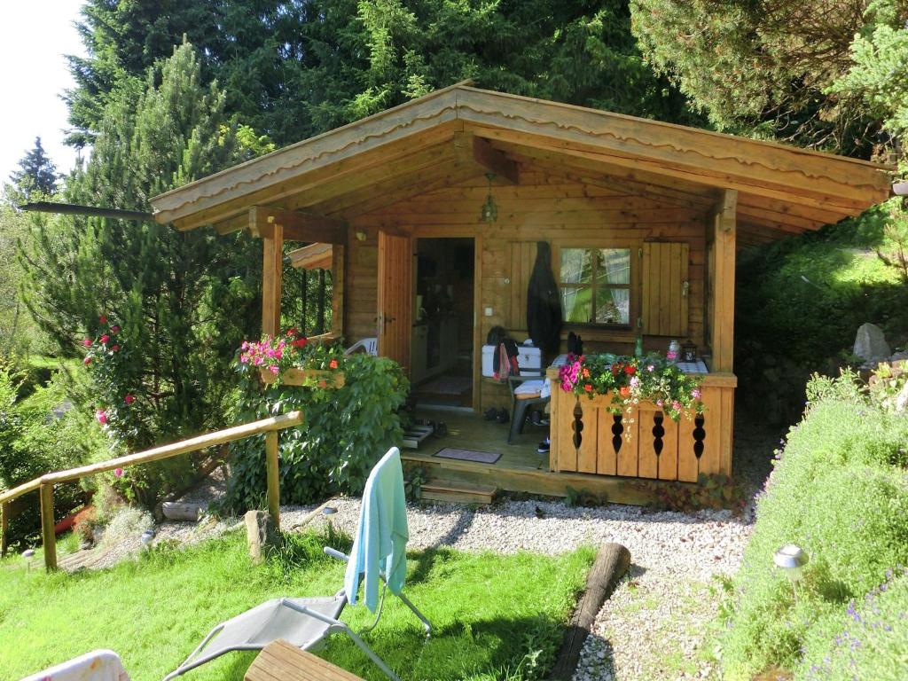 a wooden gazebo in a garden at Rural Home Near Bavarian Lakes in Steingaden