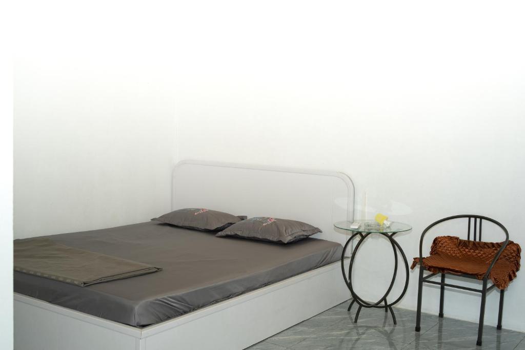 Postel nebo postele na pokoji v ubytování Nhà nghỉ bình dân Nguyen Quang