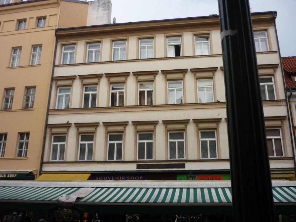 a large building with windows on a street at Apartment Havelska 10 in Prague